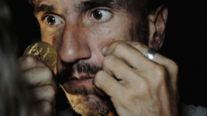 person with hands on face